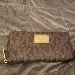 Authentic Michael Kors large zip wallet. Used.